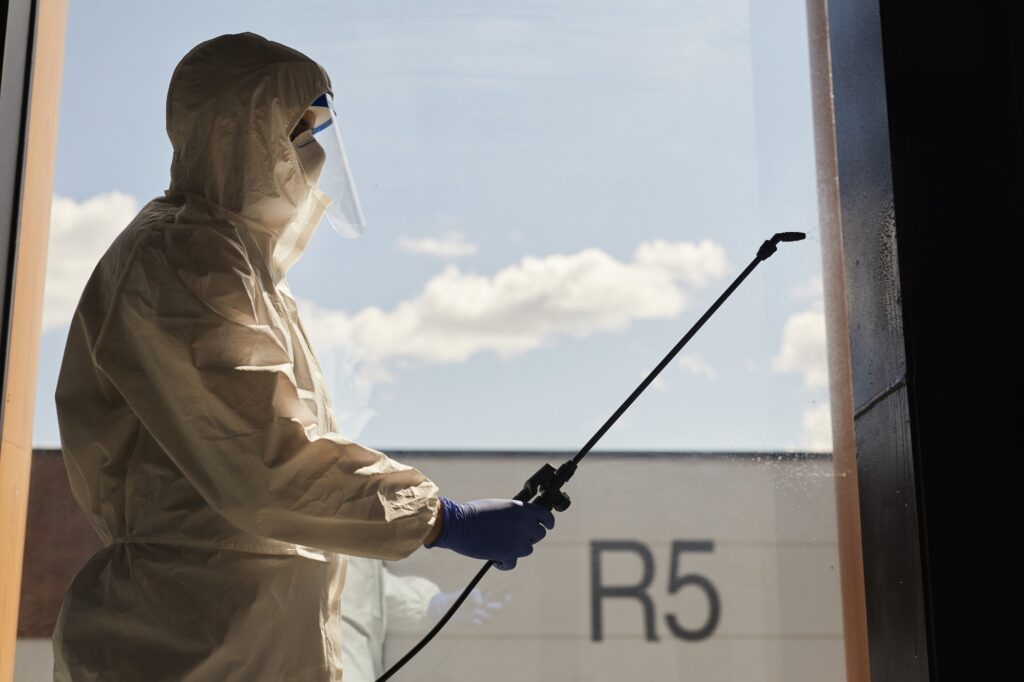Backlit Portrait of Disinfection Worker